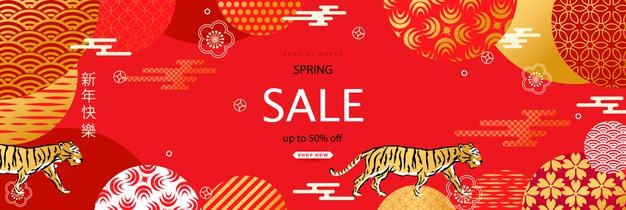 Bright sales banner with chinese elements for new year 2022. patterns in a modern style, geometric decorative ornament. the symbol of the year is the tiger. translation of hieroglyphs - happy new year