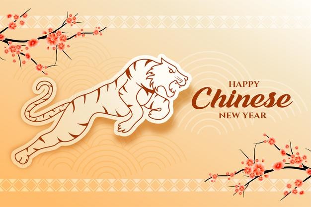 Happy chinese new year 2022 card with sakura tree and jumping tiger