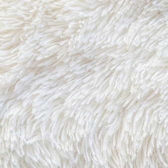 Long pile carpet texture. abstract background of shaggy white fibers. high quality photo