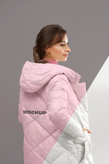 Medium shot woman presenting winter jacket
